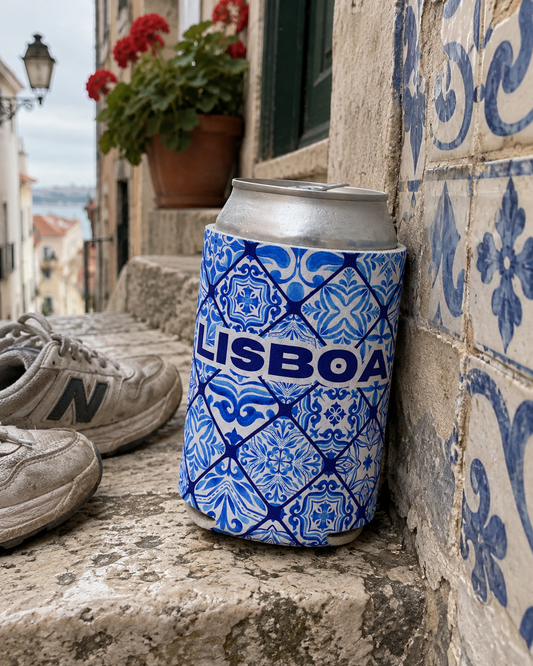 Azulejo Lisboa Tile Blue koozy leaning against an azulejo tiled wall in Alfama, Lisbon