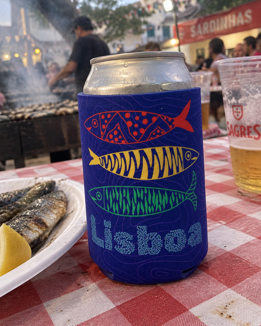Lisboa 3 Sardines Blue koozy at an outdoor sardine grill during a street festa