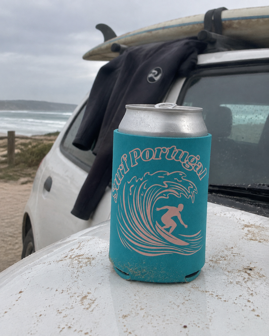 Surf Portugal Teal koozy on a car hood near the beach with a surfboard